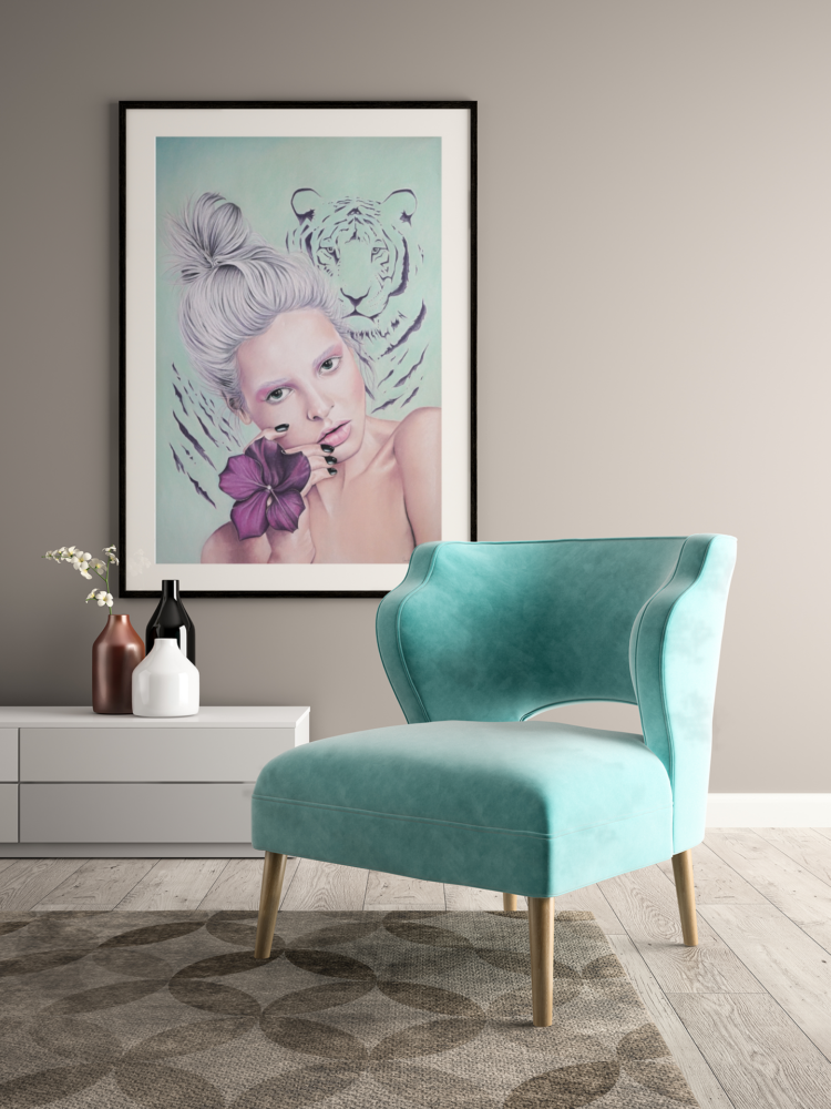 Pastel drawing of a woman with white hair and a purple flower on her hand and a tiger on a turquoise bagground hanging on the wall in a black frame next to a turquoise armchair