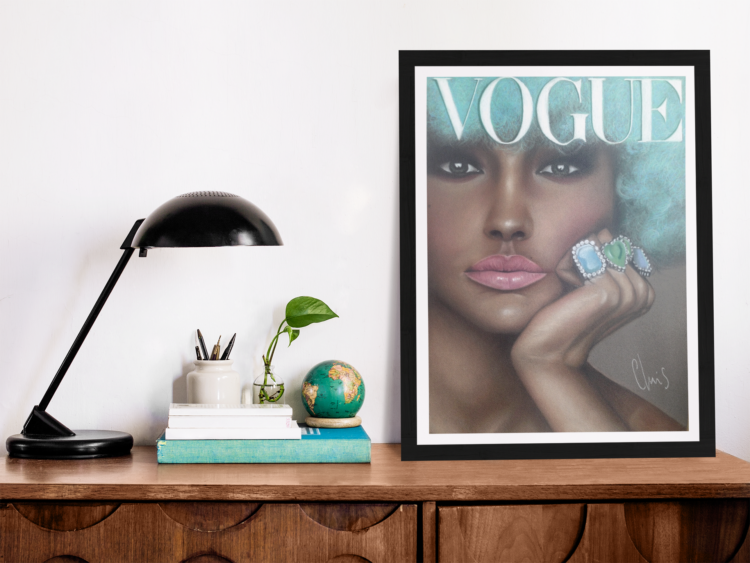 Vogue pastel drawing of a woman with turquise hair, pink lips and blue rings on her fingers in a frame standing on a wooden shelf next to some books and a black lamp