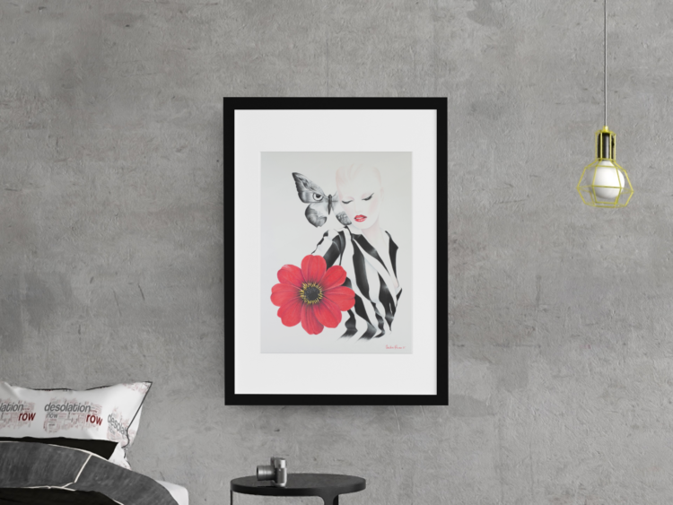 Pastel drwing with a motive of a woman in a balck and white striped shirt and a big red flower on her right side and a big butterfly next to her head in a fram hanging on a concrete wall next to a lamp and with a small black table under it