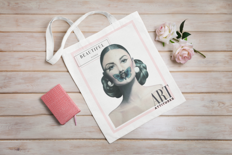 White tote bag with a motive of a woman with a butterfly over her mouth laying next to two roses