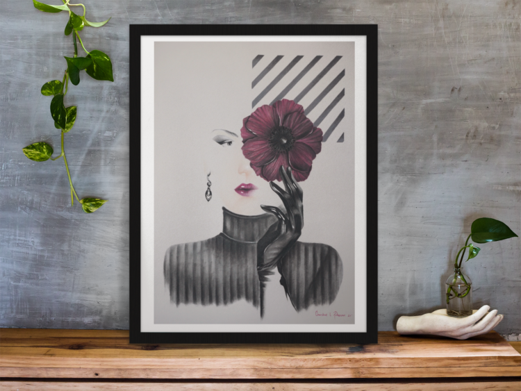 Pastel drawing with a woman with purple lips wearing a black shirt and a black glow holding a purple flower in front of her right eye in a black frame standing on a wodden shelf