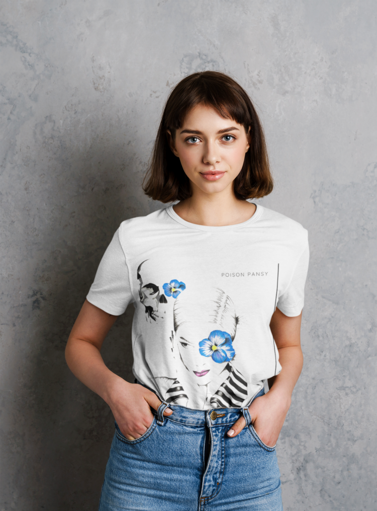 Woman wearing blue jeans and a white t-shirt with an image of woman with blue flower in frent of her left eye in a white shirt with a striped collar and a skull in the bagground with a blue flowe on it's left eye